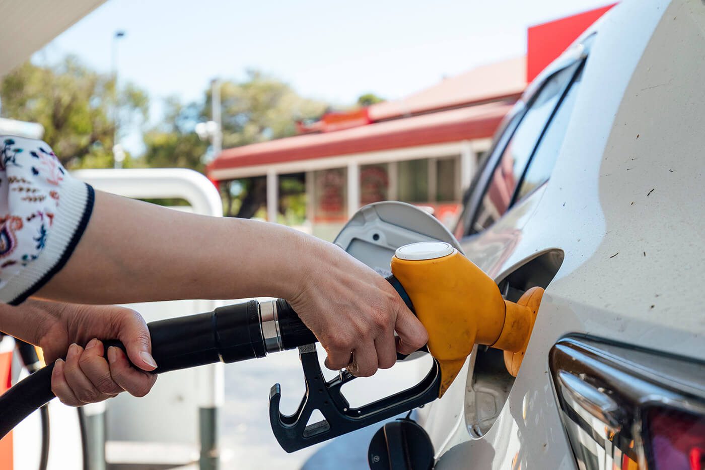 Woman pumping gas
