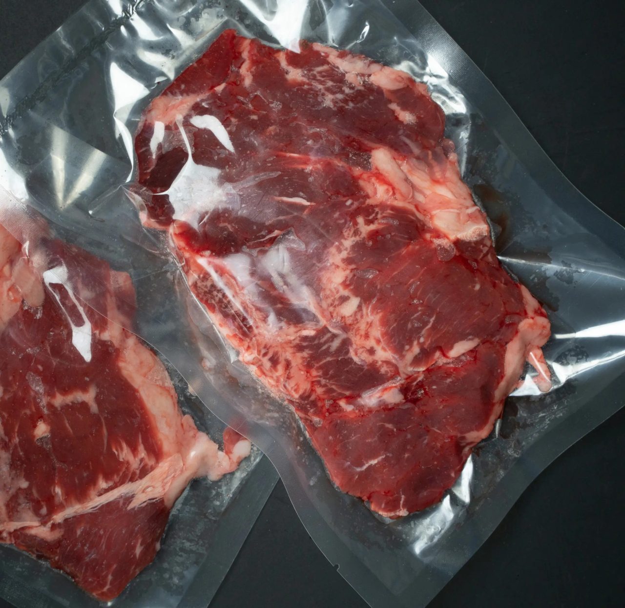 Fresh meat tightly wrapped in clear plastic film to keep them preserved