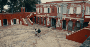 Rennisha walks by a building