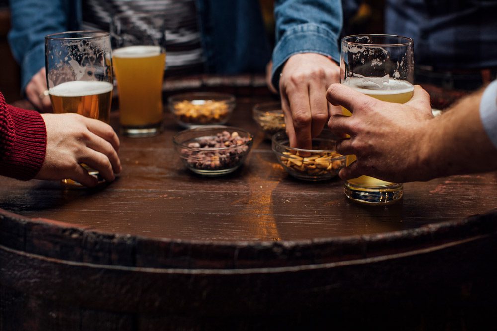 Group Consuming Beer and Snacks