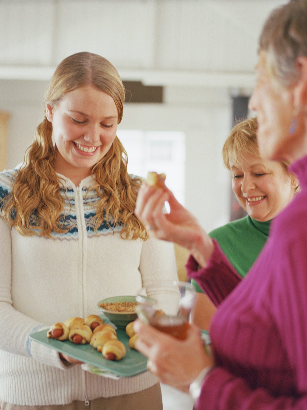 Person passing appetizer tray