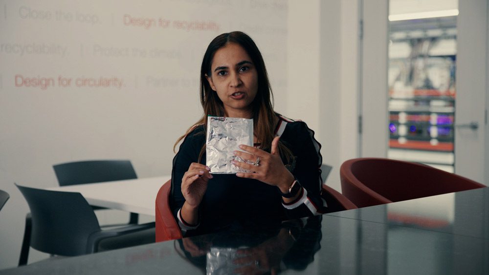 Rashi holds up plastic packaging