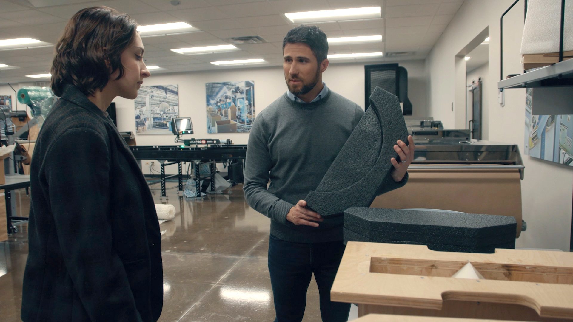 Damon talking with coworker
