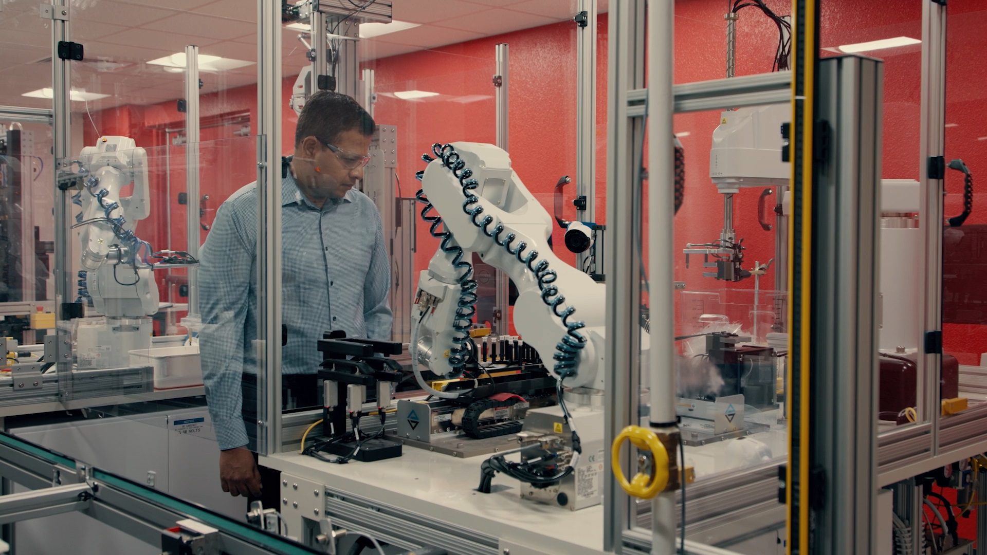 Mahesh looking at machine.
