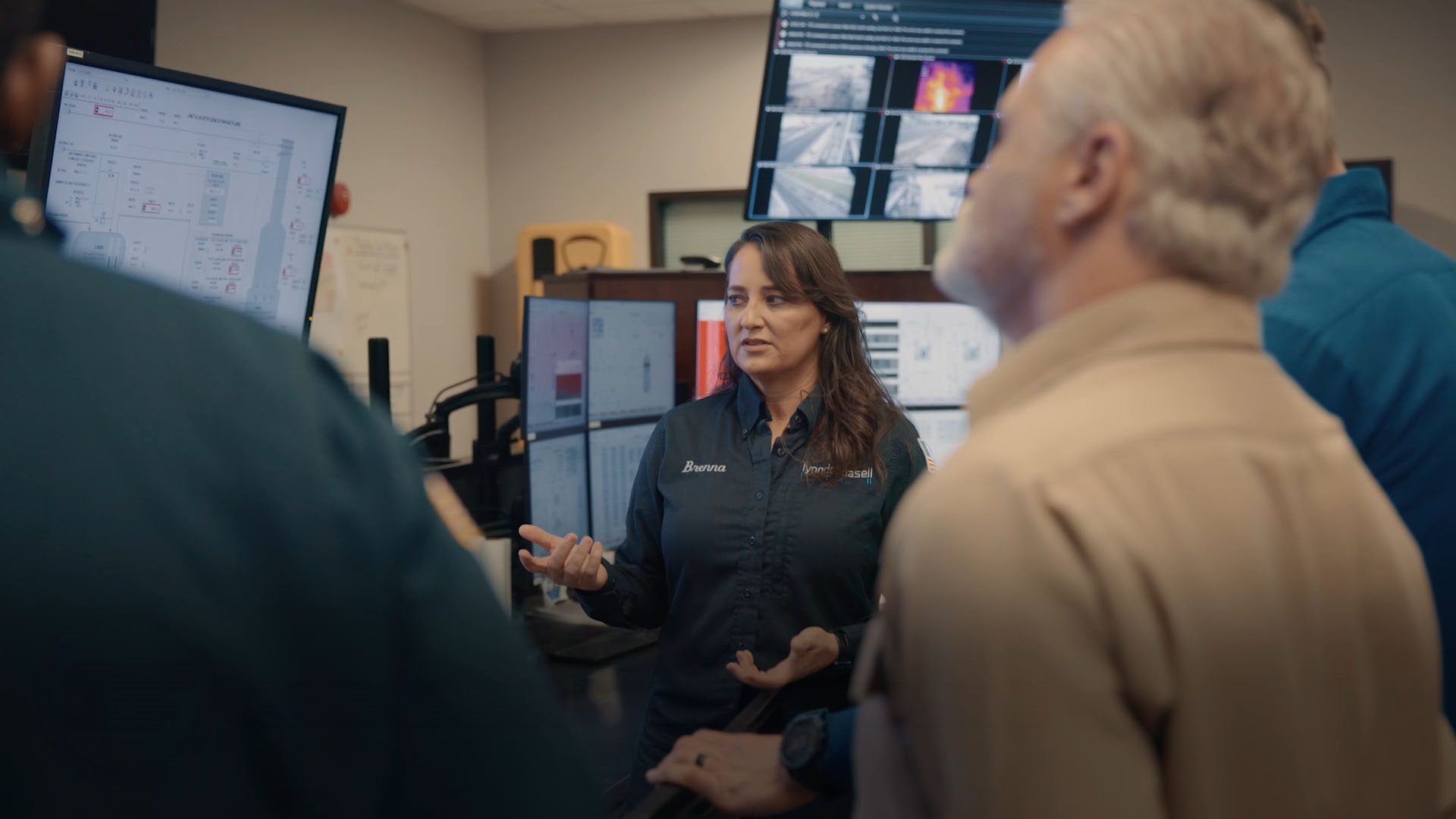 Brenna, optimization engineer, LyondellBasell speaking with coworkers