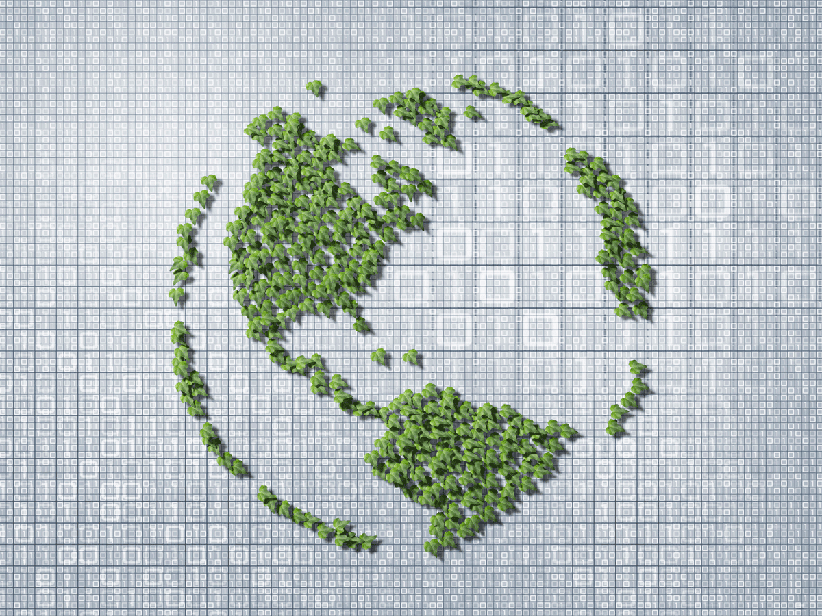 Globe made from a collage of ivy leaves on a binary code background