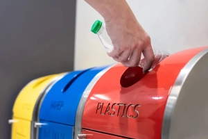 Person recycling bottles