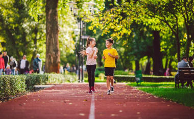 Boy and girl on rubberized walking path